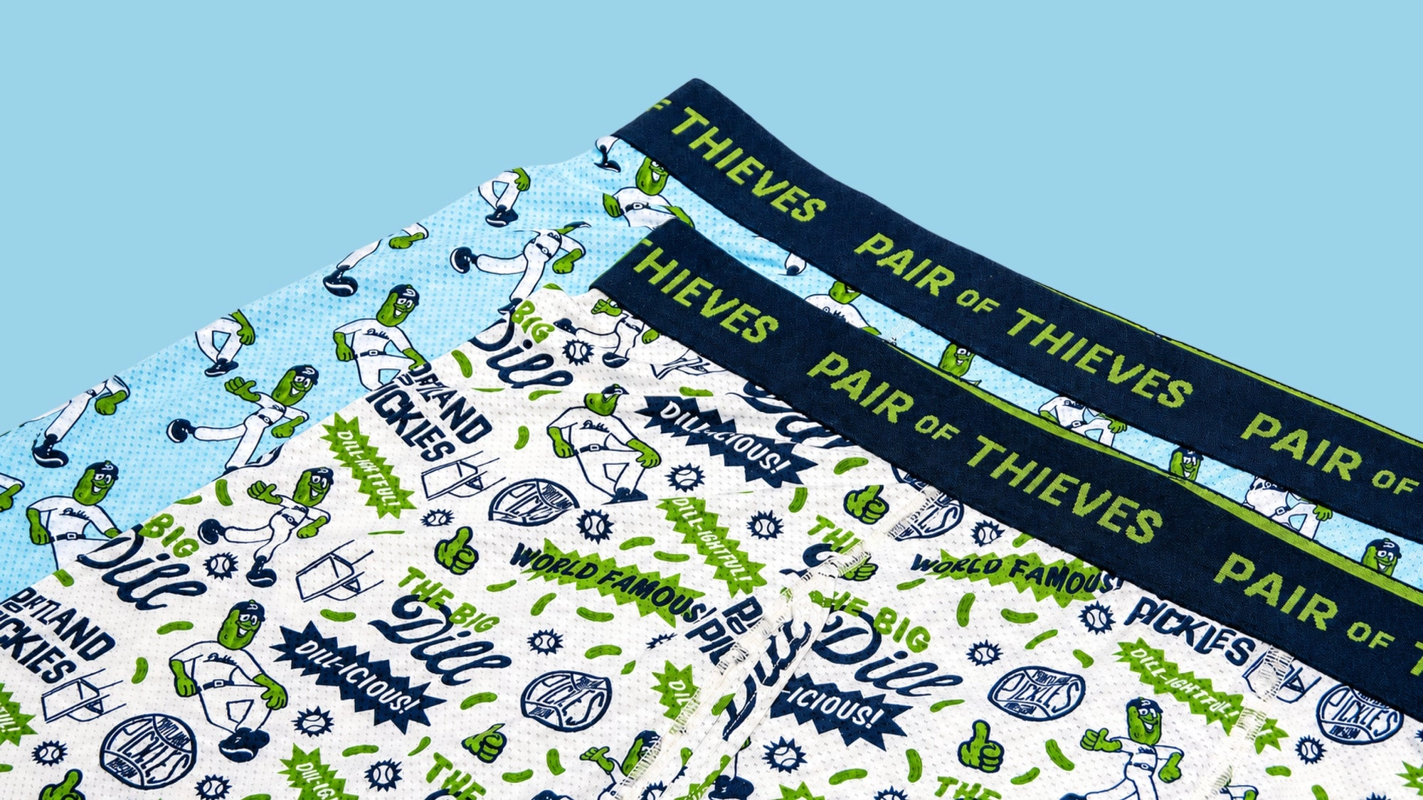 Pair of Thieves waistbands on a green and white patterned fabric